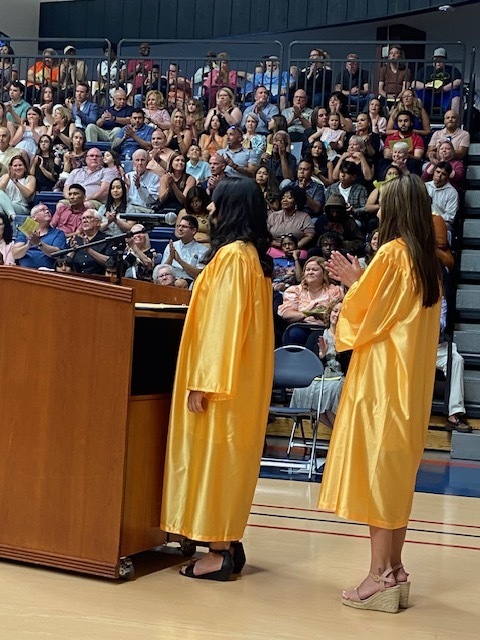 Students reading at the microphone